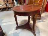 a table with a chair and a chair in a room