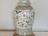 a vase with a lid sitting on a table