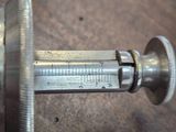 a close up of a metal needle on a table