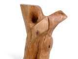 a wooden sculpture of a bird that is sitting on a branch