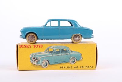 a blue toy car sitting on top of a box