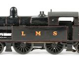 a toy train that is sitting on a white surface