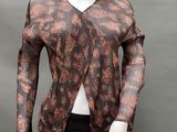 an image of a mannequin mannequin wearing a brown and black top