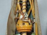 a figurine of a man riding a horse on top of a tower