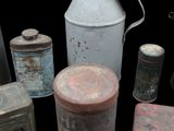 many old tins that are sitting on a table