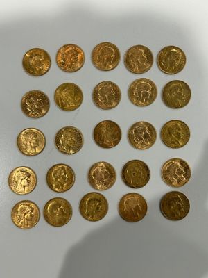 a lot of gold coins that are on the table