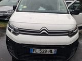a white van that is parked in a parking lot