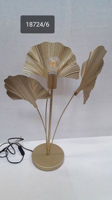 a lamp that is on a table with a cord
