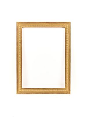 a gold picture frame against a white wall