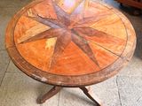 a wooden table with a star design on it