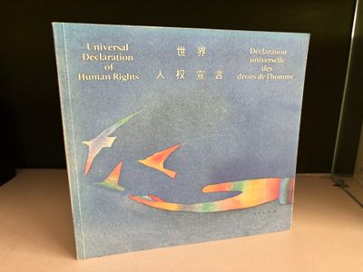 a book that is sitting on a table in front of a window