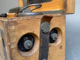 a wooden box that has a camera inside of it