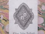 a small piece of paper with a picture of a coat of arms on it