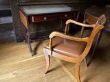 a chair that is sitting in front of a desk