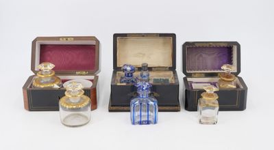 several different types of perfume bottles are lined up on a white surface