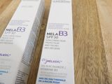 two tubes of melasy on a table next to each other