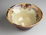 brown and white bowl with cracky glaze on the outside