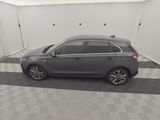 an image of a grey car in a garage