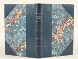 a blue book with a marbled cover on it
