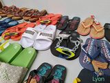 several pairs of flip flops are lined up on a table