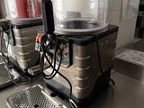 two coffee machines sitting on a counter in a kitchen