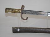 an old sword is displayed on a glass stand with a wooden handle
