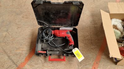 a box with a corded drill and a box with a corded drill