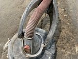 a pipe that is attached to the side of a building