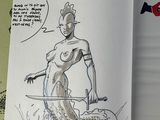 drawing of a woman in a bikini holding a sword in a book
