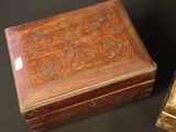 pair of antique wooden boxes sitting on a black surface