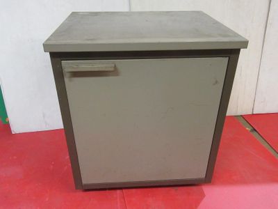 an image of a small refrigerator sitting on top of a red floor