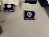 several silver coins are sitting on a table next to a receipt