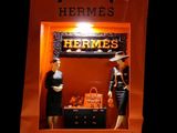 two mannequins in a window display of hermes ' s
