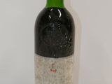a bottle of wine that is sitting on a table