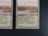 two cards that are on display on a table