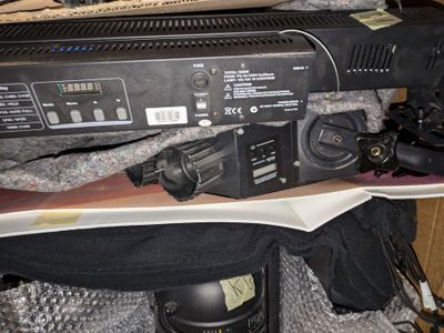 an image of a remote control system on top of a pile of clothing