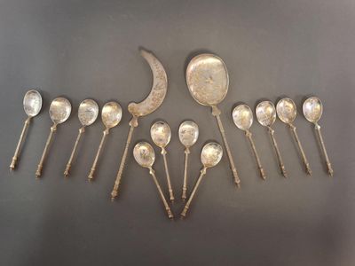 six silver spoons and spoon spoons are arranged in a row