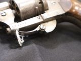 a gun that is sitting on a black cloth