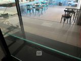 a glass display case in the middle of the room