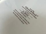 a white plate with a black and white label on it