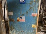 a blue refrigerator in a dirty room with a lot of dirt on the floor