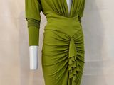 a woman ' s green dress on a mannequin mannequin mannequin mannequin mannequin mannequin mannequin mannequin