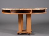 a close up of a wooden table with a marble top