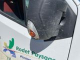 a close up of a white truck with a logo on the side of it