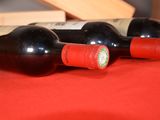three bottles of wine sitting next to each other on a table