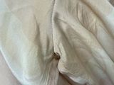 an image of a bed with a blanket and a pillow