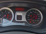 a close up of a car dashboard with a speedometer and gauges