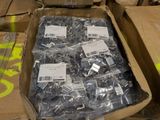 a box full of assorted metal parts on a table