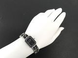 an image of a woman ' s wrist with a watch on it