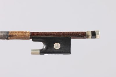 a close up of a violin bow on a white background